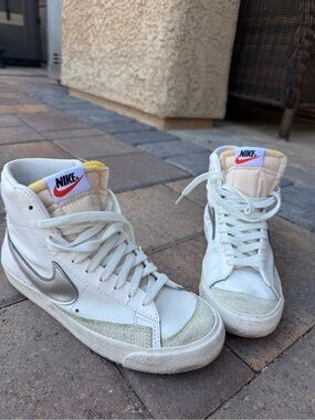 Nike White High-Top Sneakers with Silver Swoosh and Yellow Tongue Trim